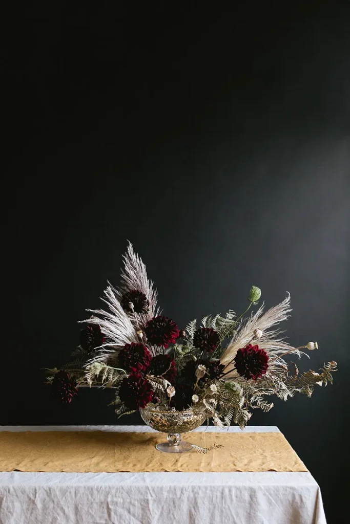 12 Stunning Halloween Florals to Inspire a Spooky Event / Dark and moody floral arrangement