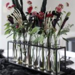 12 Stunning Halloween Florals to Inspire a Spooky Event / Tube centerpiece with moody flowers